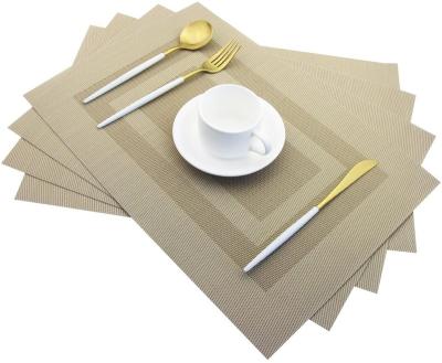 China 2022 New Design Woven CR Vinyl Stocked Heat Insulation Non Slip Plastic Place Mats For Dining Table Set Of 4 for sale