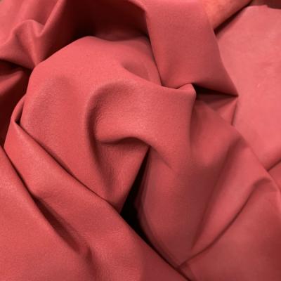 China Red color sheep lamb grain leather for dust coat pelisse for sale