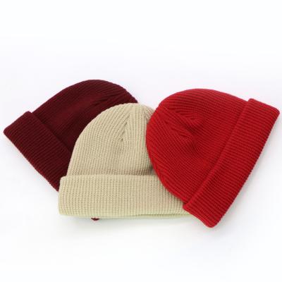 China COMMON Cheap Winter Hat Men Slap Beanies Woven Black Acrylic Patch Beanie Hat for sale