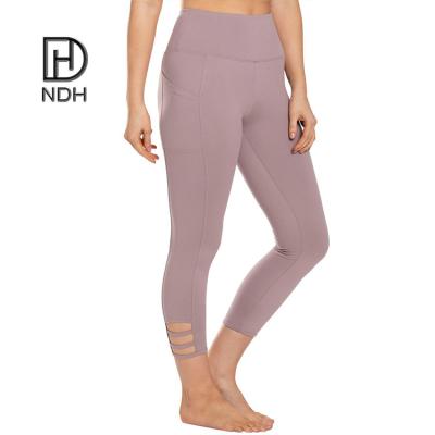 China Breathable Ladies Stretchy High Waist Sports Lace Up Leggings With Pockets Yoga Capris Leggings for sale