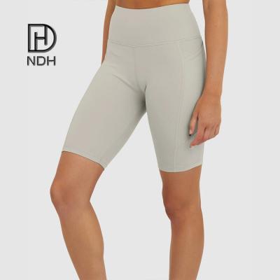 China Breathable Gym Workout Woman Shorts With Pockets And Interlock Seams Recycle Polyester Fabric Sustainable Shorts for sale