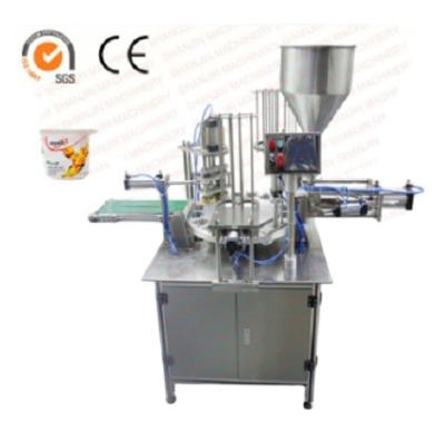 China Automatic Rotary Beverage Soymilk Cups Filling Sealing Machine for sale