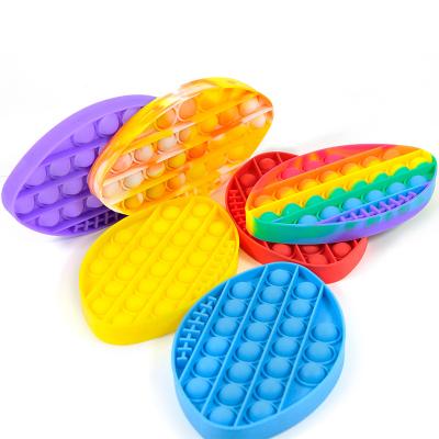 China Sensory Reliever Toy For Anxiety Relief Stress Toy Low Moq PopIt Busty Person Funny Educational Bubble Toy Silicone Rugby Shape Colorful for sale