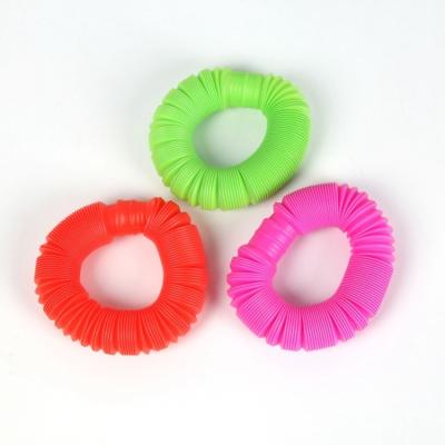 China Trigger toys high quality fidgety person toys release stress relief hose colorful plastic stretchy fidgety person sensory toys for kids for sale