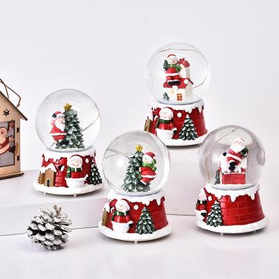 China Polyresin Resin Crystal Ball LED Music Christmas Snowflake Glass Crystal Ball for sale