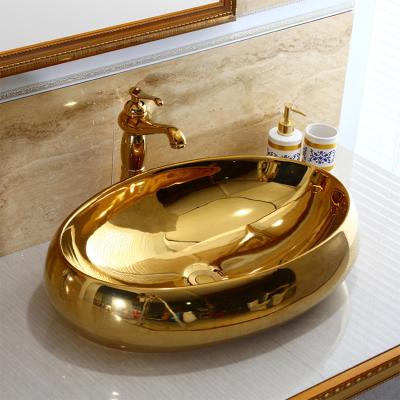 China Popular European Style Waterproof Above Oval Hand Wash Sink Sink Minimalist Gold Plating Countertop Oval Basin For Bathroom for sale