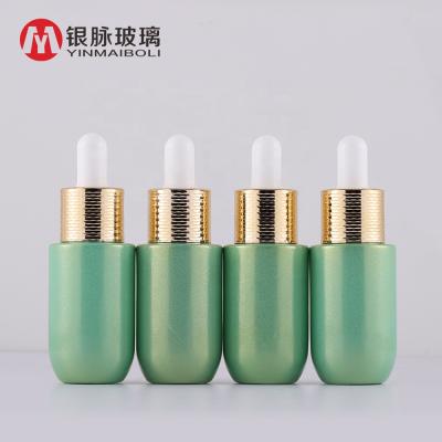 China Personal Care Wholesale 15ml Pearl Green Essential Oil Glass Dropper Bottle With Honeycomb Ring Lid for sale