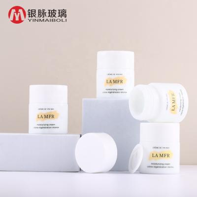 China Custom Printing Logo Personal Care White Opal White Porcelain Jar 30ml Glass Cosmetic Cream Jar With Lid for sale