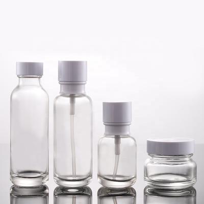 China Personal care latest quality glass cosmetic bottle set cream glass bottles and clear cosmetic glass cosmetic packaging jars for sale