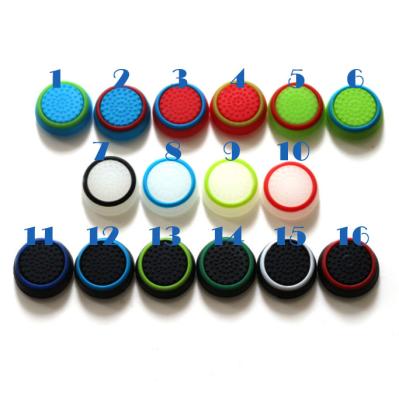 China Prevent Controller Thumbstick From Slipping High Quality Dual Colors Luminous Silicone Rubber PS4 Thumb Grips PS5 Controller Grips for sale