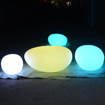 China Decorative & waterproof colorful led outdoor practice co-exsit diameter stone statue light stone shaped solar stone light for sale