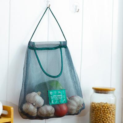 China Cheap Folding Hanging Mesh Bag Vegetables Storage Bag Organizer Portable Kitchen Storage Shopping Bag for sale