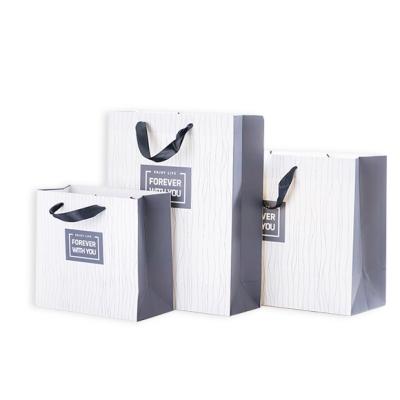 China Recyclable New Design Spin Top Paper Shopping Bag With Twisted Handle for sale