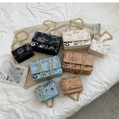 China Newest Fashinable Summer New Arrival S-M Two Sizes Trendy PU Graffiti High Quality Handbag Messenger Bag All-match Single Color Chain Armpit Bag for sale