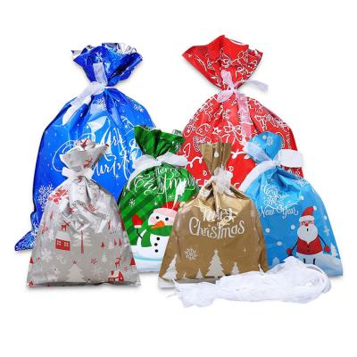 China Christmas Drawstring Foil Gift Bags , Holiday Ribbon Gift Bags for sale