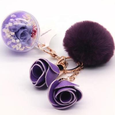 China Environmental Protection Green Christmas Decorating Handmade Preserved Roses In Glass Ball Used As Key Chain for sale