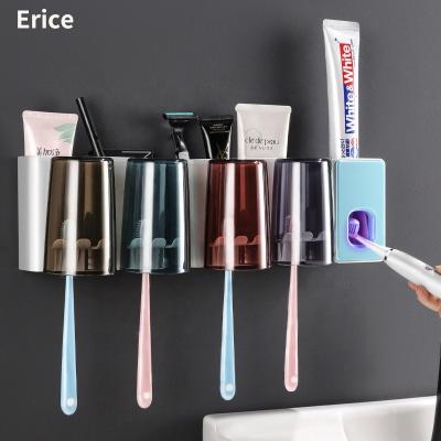 China Wall Mounted Plastic Holder Household Storage Toothpaste Dispenser Automatic Stored Toothbrush Holder With Transparent Color for sale