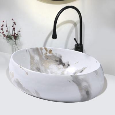 China Durable Modern Oval Marble Look Basin Modern Oval Marble Look Luxury Hotel Bathroom Art Marble Wash Basin Countertop Ceramic Vessel Sink for sale