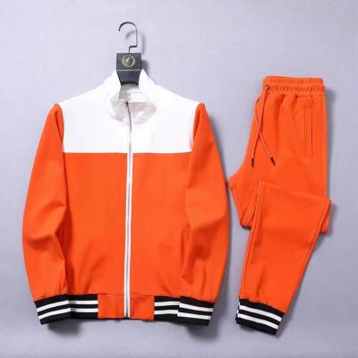 China Manufacturer Fashion Mens Tracksuit Reasonable Price Breathable Plus Size Full Sets Orange White Color Tracksuit for sale