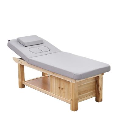 China Modern Full Stocked Solid Wood Four Leg Facial Spa Table Massage Bed for sale