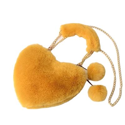 China Lovely Price 2021 Soft Heart-shaped Hairpin Fluffy Fur Handbag Waterproof Cheap Price Tipped Shoulder Bag Women Girl's Fur Bag for sale