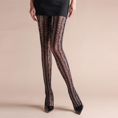 China Hot Selling Breathable Black Woman Jacquard Pattern Hollow-out Nylon Sexy Fishnet Transparent Pantyhose for sale