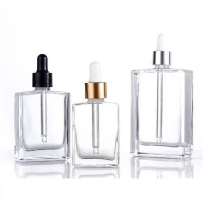 China 1oz 15ml 30ml 50ml 100ml cosmetic novelty fancy square glass bottle for essential oil with gold silver dropper for sale