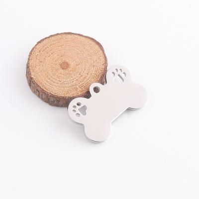 China 2022 New Design CLASSIQUE 2022 White Dog Bone Hollow Paw Charms Mirror Polish Stainless Steel Pendant for sale