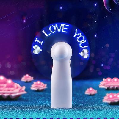 China Mini LED Cooler Creative Desktop Battery Operated Fan Gift Preset Text Festival Confession Flashing Light Portable Fan for sale