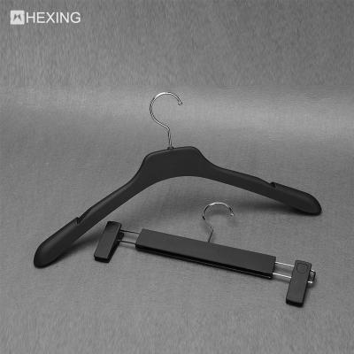 China Multifunctional Customized Printing Logo Plastic Pants Black Coat Hanger for sale