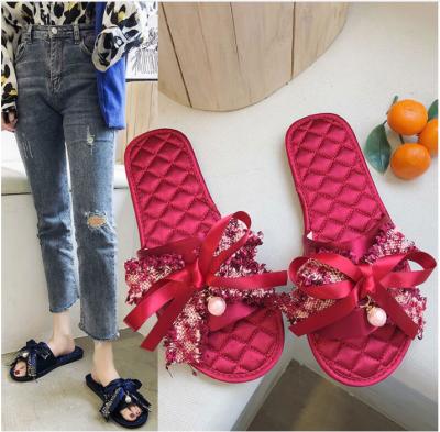 China Popular fashion trend wholesale summer women sandal with bow decoration ladies slipper flat girls for sale