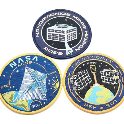 China eco-friendly custom 3D logo embroidery patches garment accessories round hot melt embroidery adhesive badges for sale