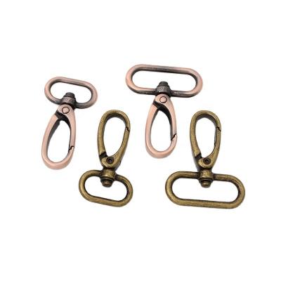 China Nolvo Durable 19mm 30mm World Metal Buckle Bronze Bag Hugs Lobster Swivel Trigger Clips Snap Hook For Handbag Parts for sale