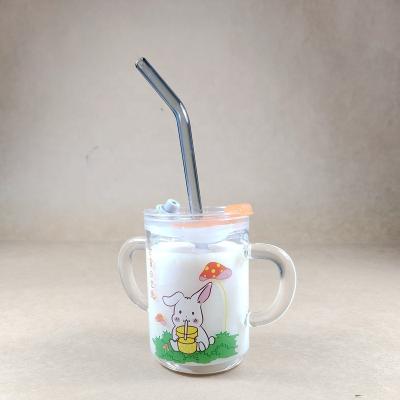 China Hot Sale Disposable Glass Milk Cup/Handmade Boro Single Wall Glass Cup /Baby Use Double Handle Milk Cup with Safe Food Grade Silicone Lid for sale