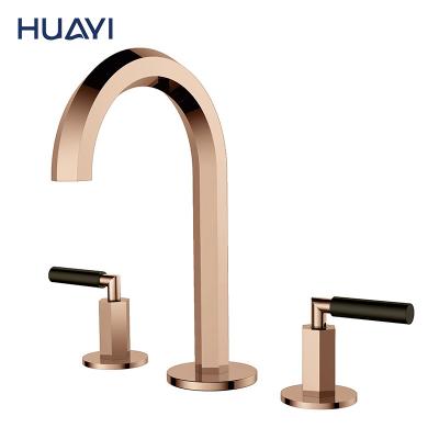 China Huayi Basin Faucets Brass Metered Rose Gold Bathroom Faucet 3 Hole Taps Basin Mixer for sale