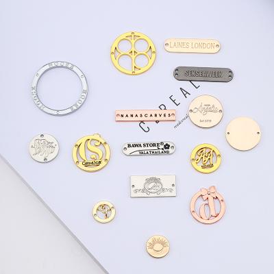 China Sustainable Durable Small Metal Tag Waterproof Bikini Fashion Swimwear Gold Round Metal Clothing Labels For Clothing for sale