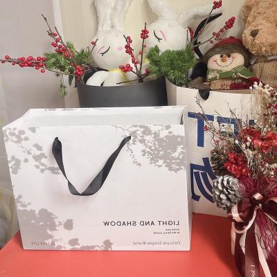 China Recyclable Wholesale Custom Printed Logo Luxury White Paper Bag Box Small Business Retail Shopping Gift Paper Bag With Handle Your Own Logo for sale