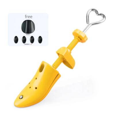 China Latest New LM-P5505 Heart Shaped Plastic Shoe Expander Height Adjustable Shoe Support for sale