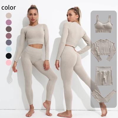 China SKIRTS sports seamless solid color fitness clothing European and American yoga clothes fit women's long sleeve stretch yoga tight pan for sale