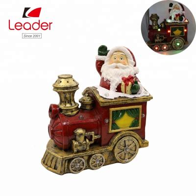 China Christmas LED Lights High Quality Decorative Resin Santa Statue LED Lights Santa in Car Christmas Decoration for sale