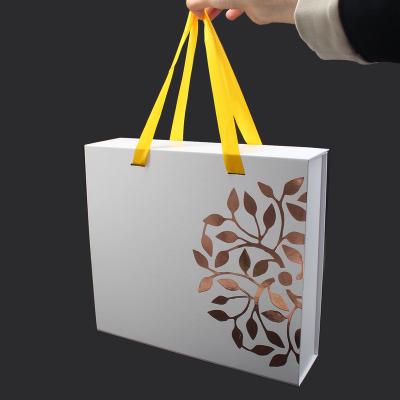 China Recyclable Luxury Large White Rigid Cardboard Foldable Medium Elegant Magnetic Gift Box With Ribbon Luster Custom Logo for sale