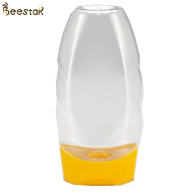 China Food Grade Plastic Factory Price Special Plastic Honey Jar And Spoon 335ml Empty for sale