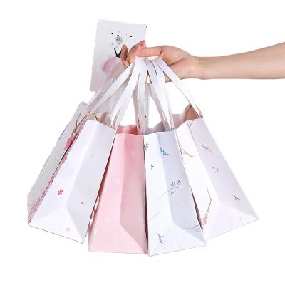 China Recycled Custom Paper Gift Bag Logo Print Wholesale Grocery White Brown Packaging Materials With Handle Industrial Item Outer Packaging for sale