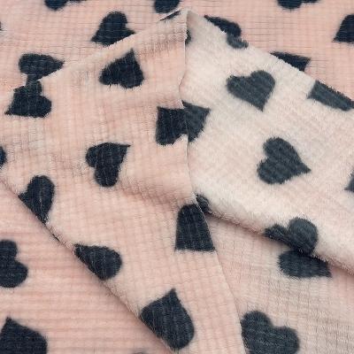 China 100%polyester anti pill recycled printed jacquard flannel fleece fabric for home textiles for pajamas for sale