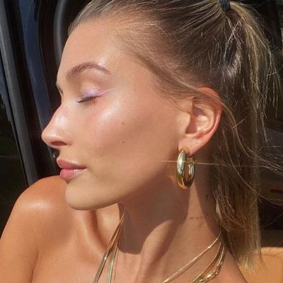 China FASHIONABLE Hailey Bieber matching hollow circle earrings jewelry 18K base soft copper plated factory Amazon wholesale hot for sale