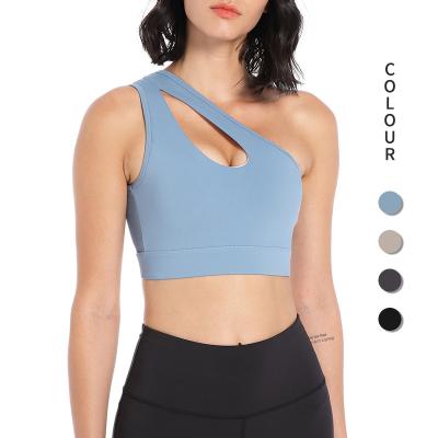 China Breathable One Shoulder Sports Bra For Women One Strap Sports Bra Removable Padded Sexy Bra With Hollow Out Design for sale