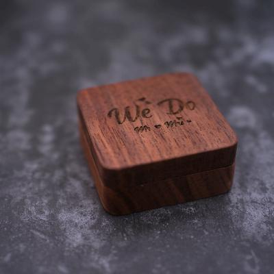 China Wooden Wedding Ring Holder Rustic Portable Wedding Handmade Rustic Walnut Jewelry Boxes Engraved Wooden Ring Box for sale