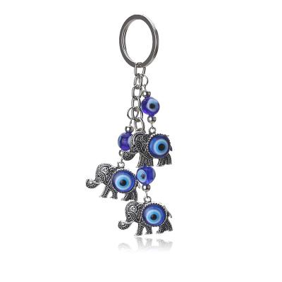 China Fashionable Hot Selling Evil Eyes Evil Eyes Silver Plated Key Chain Ethnic Blue Eyes Environmentally Friendly Three Elephants Pop It Key Chains for sale