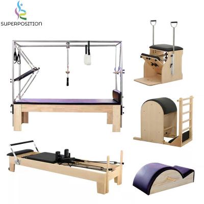 China Full Studio Fitness Gym Trapeze Pilates Reformer Eco-Friendly Combo Home Exerciser Cadillac With Tower for sale