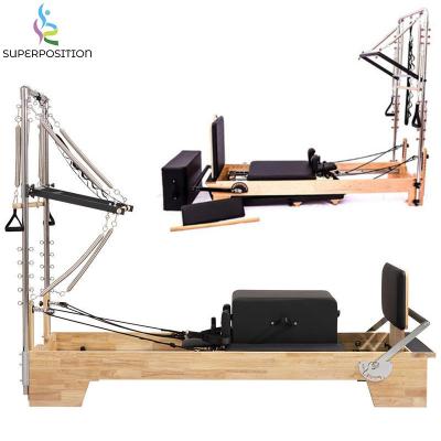 China Custom logo fitness center durable oak wood gym yoga exercise pilates reformer with half turn trapeze for sale